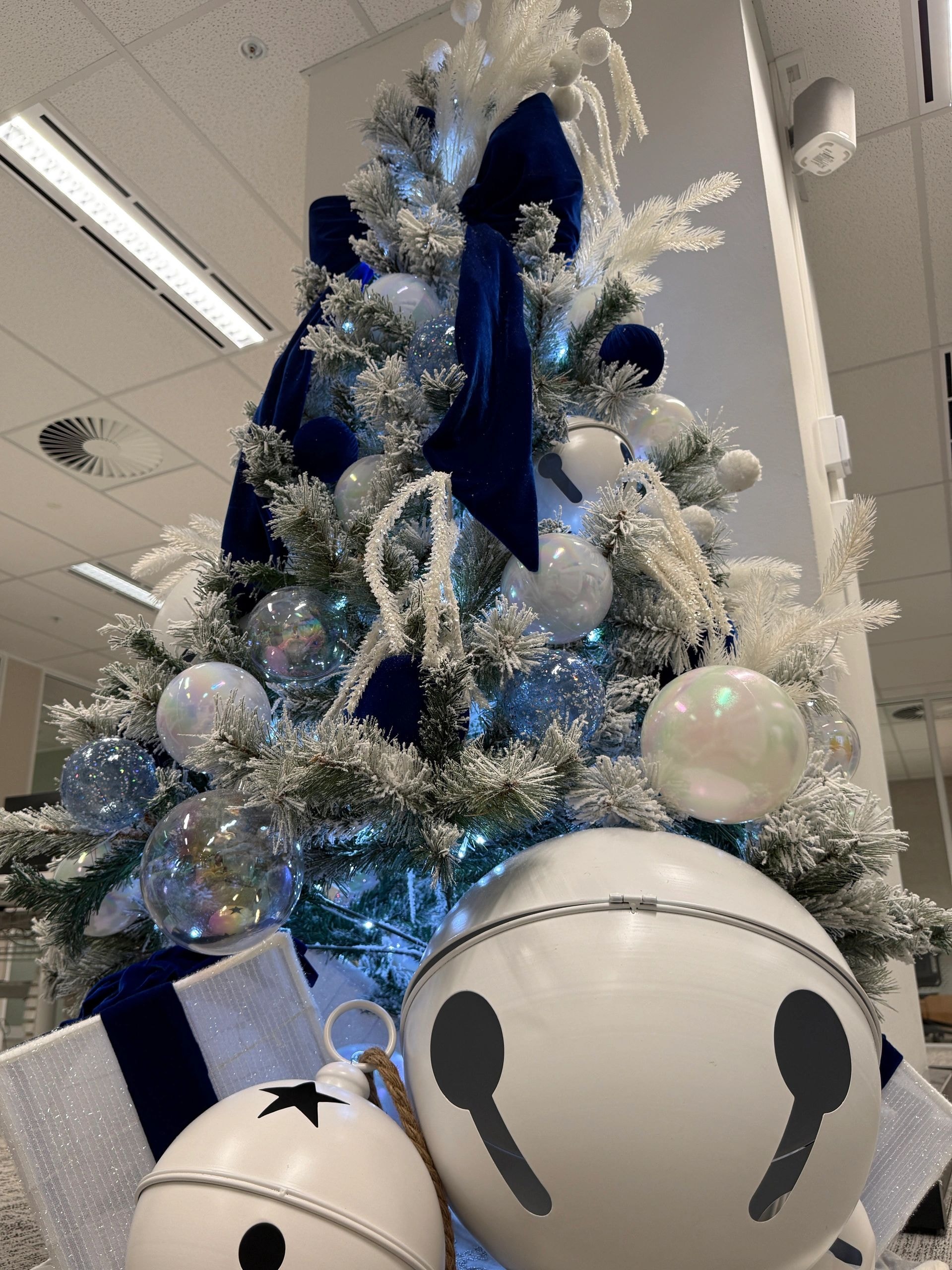 Blue and white frosted Christmas tree display
