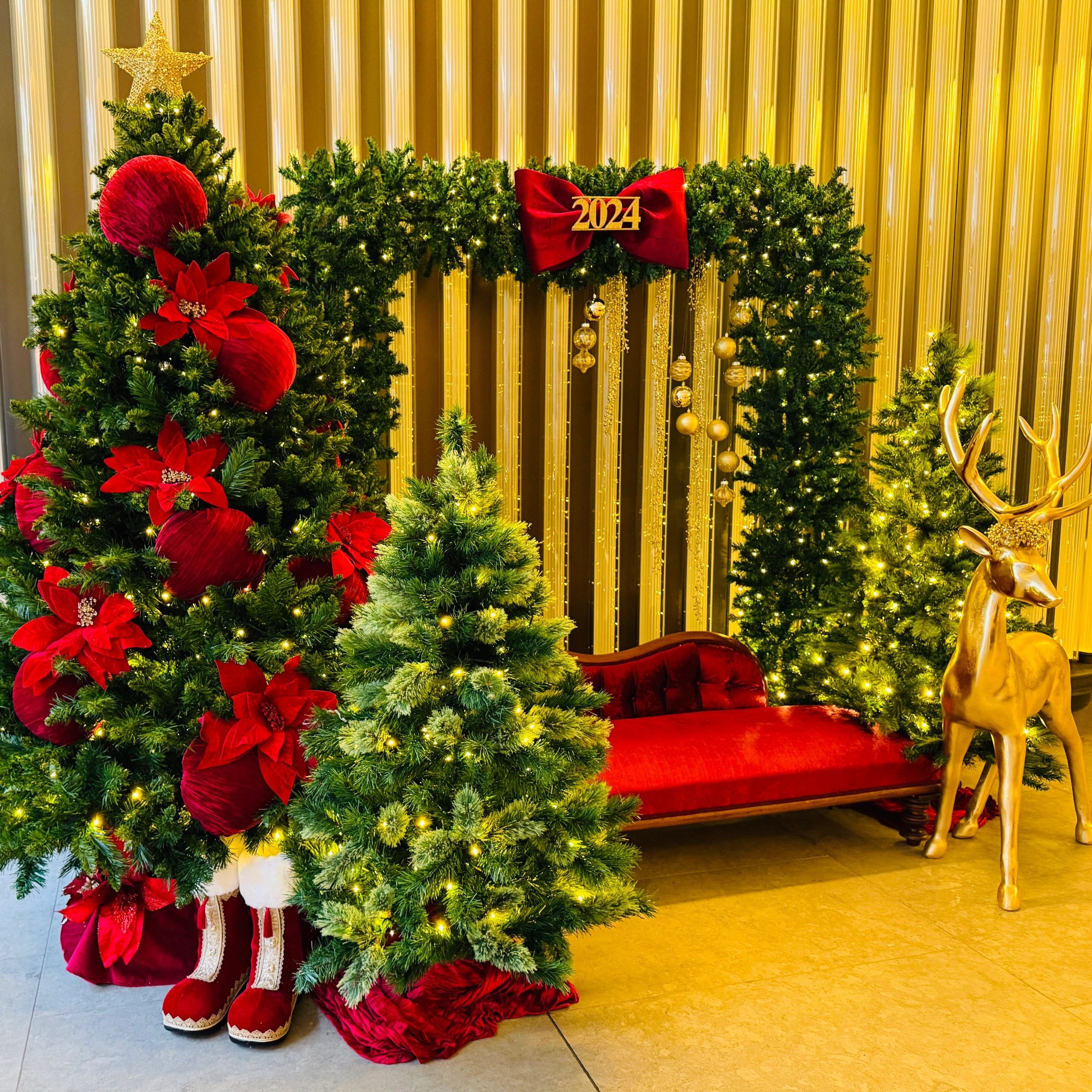 Red and gold Christmas installation with reindeer