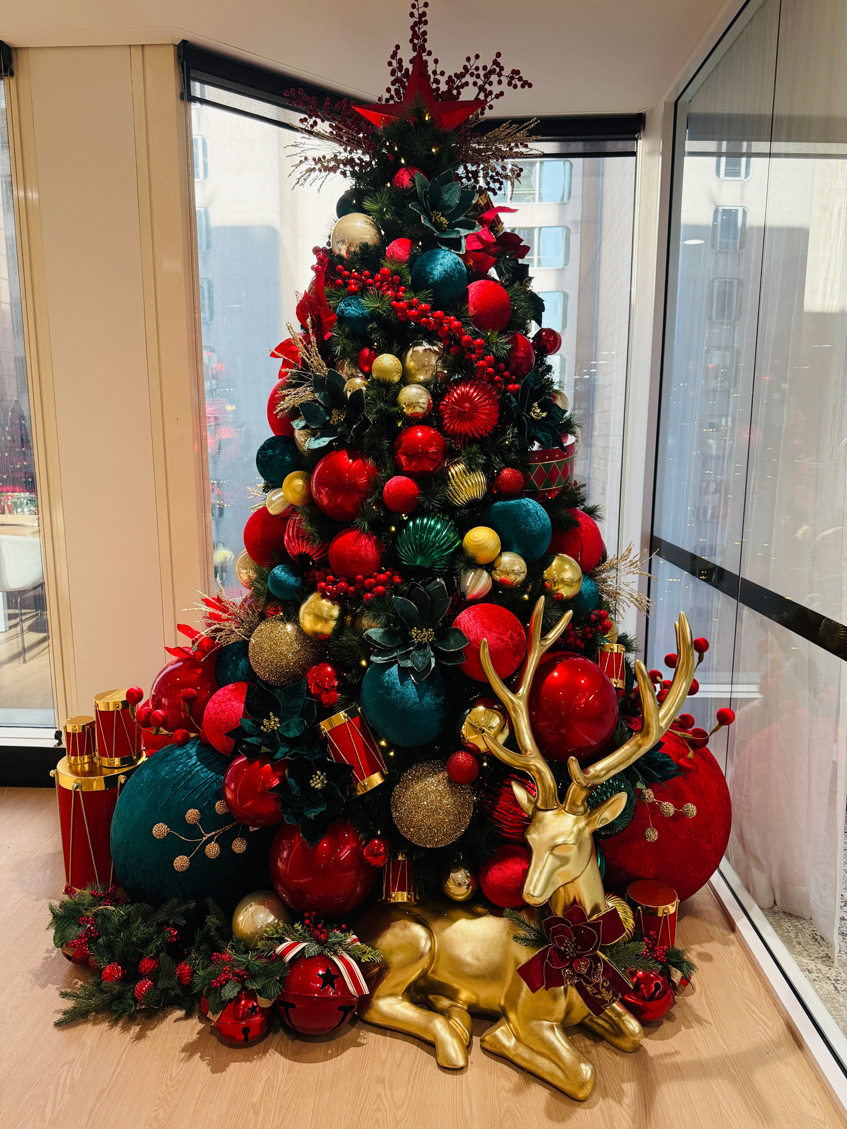 Luxury red and teal Christmas tree with gold reindeer